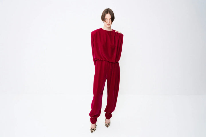 Velvet jumpsuit with shoulder draping