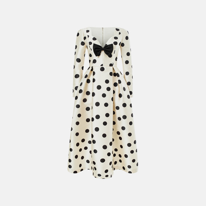 Polka-dot dress with a sculptural neckline and bow