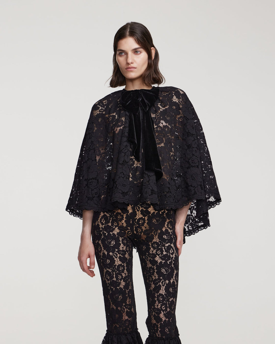 Cord lace cape with decorative bow