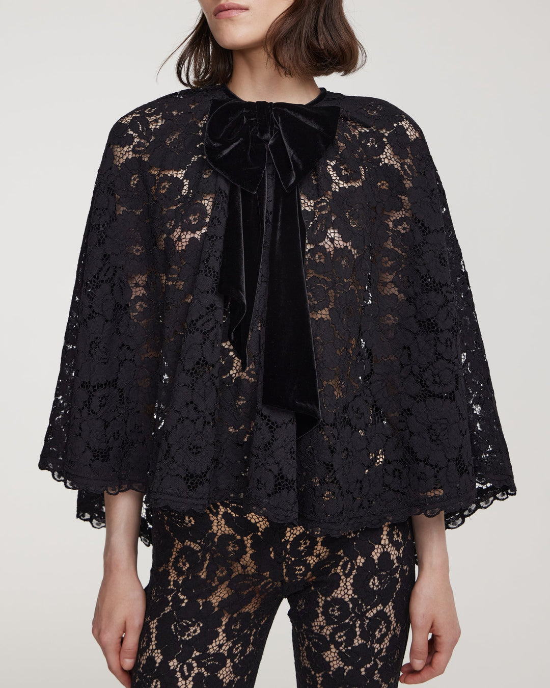 Cord lace cape with decorative bow