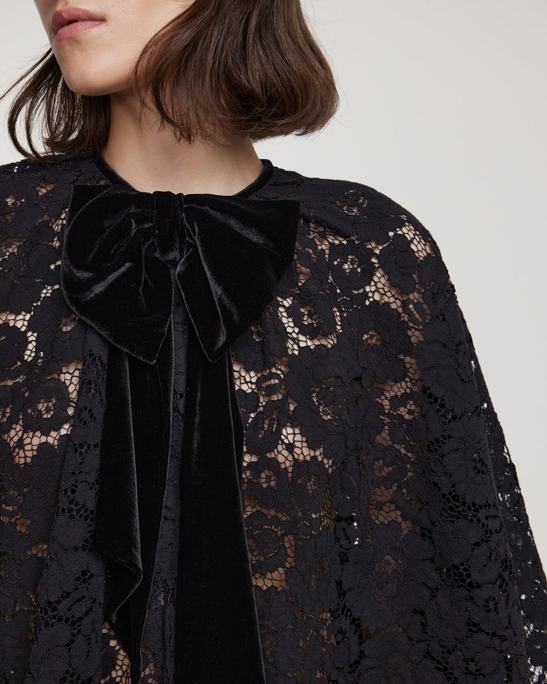 Cord lace cape with decorative bow