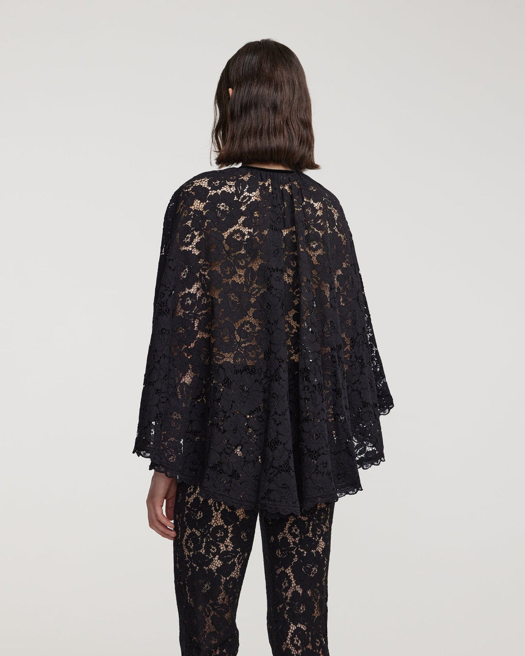 Cord lace cape with decorative bow