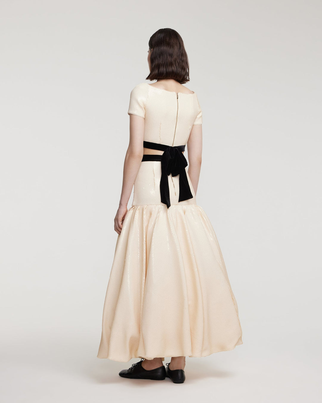 Sequin top with decorative bow