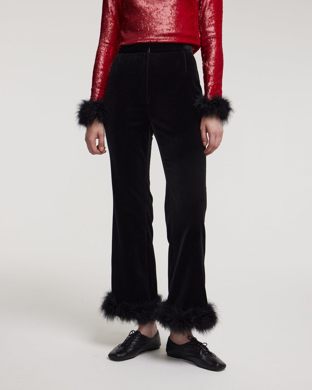 Trousers with marabou feather trim