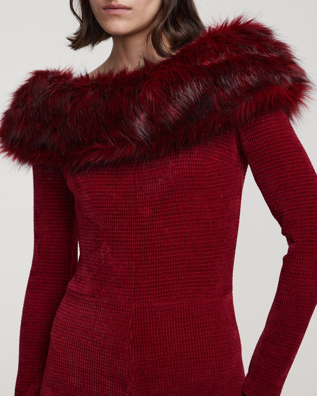 Knit jumpsuit with faux fur trim