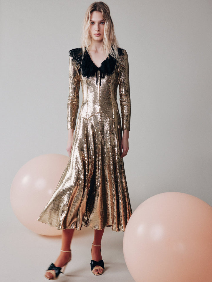 Sequinned dress with a lace collar