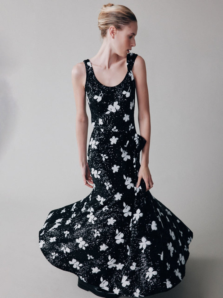 Sequinned dress with a waist bow