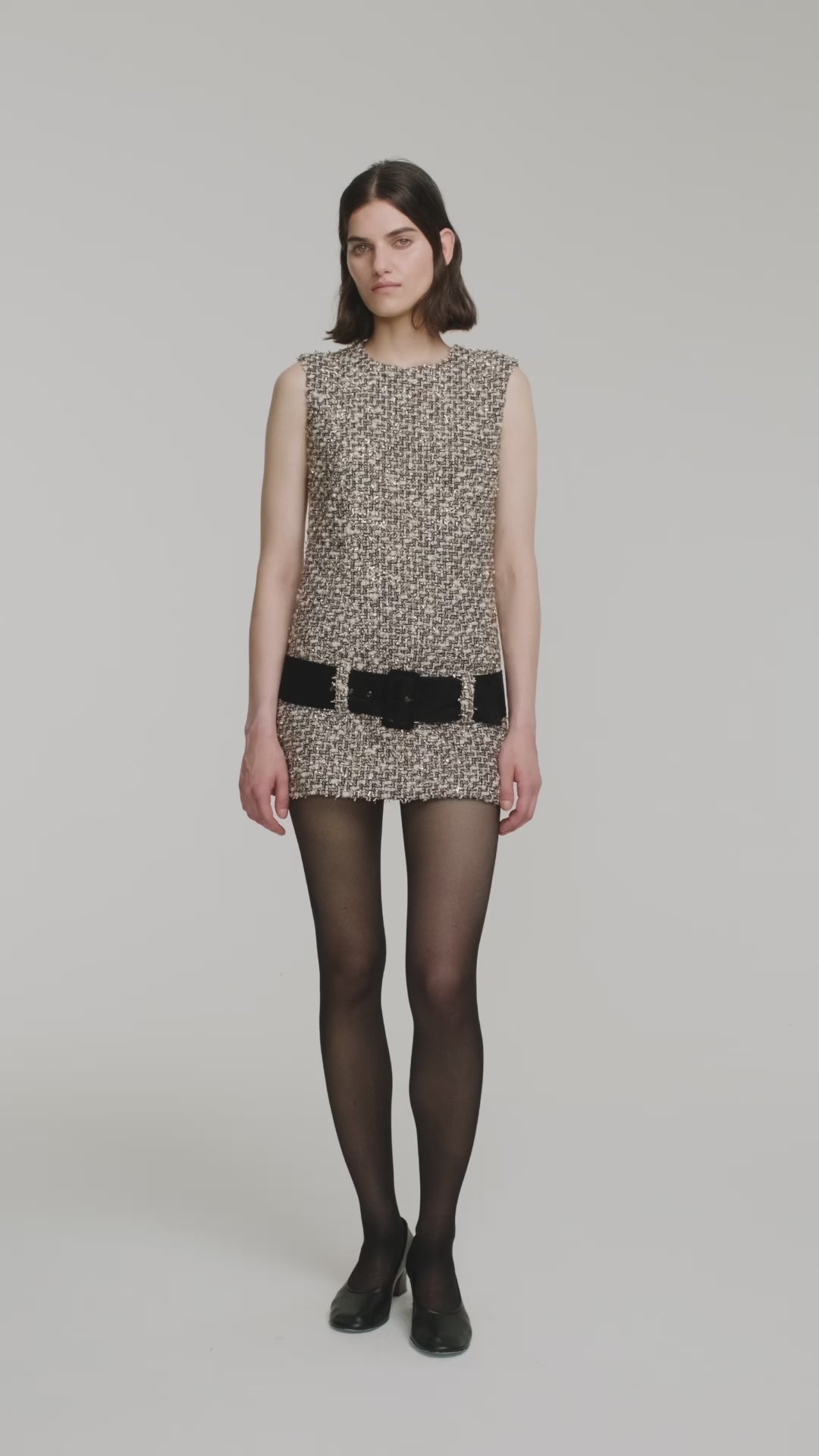 Sleeveless tweed mini dress with suede belt