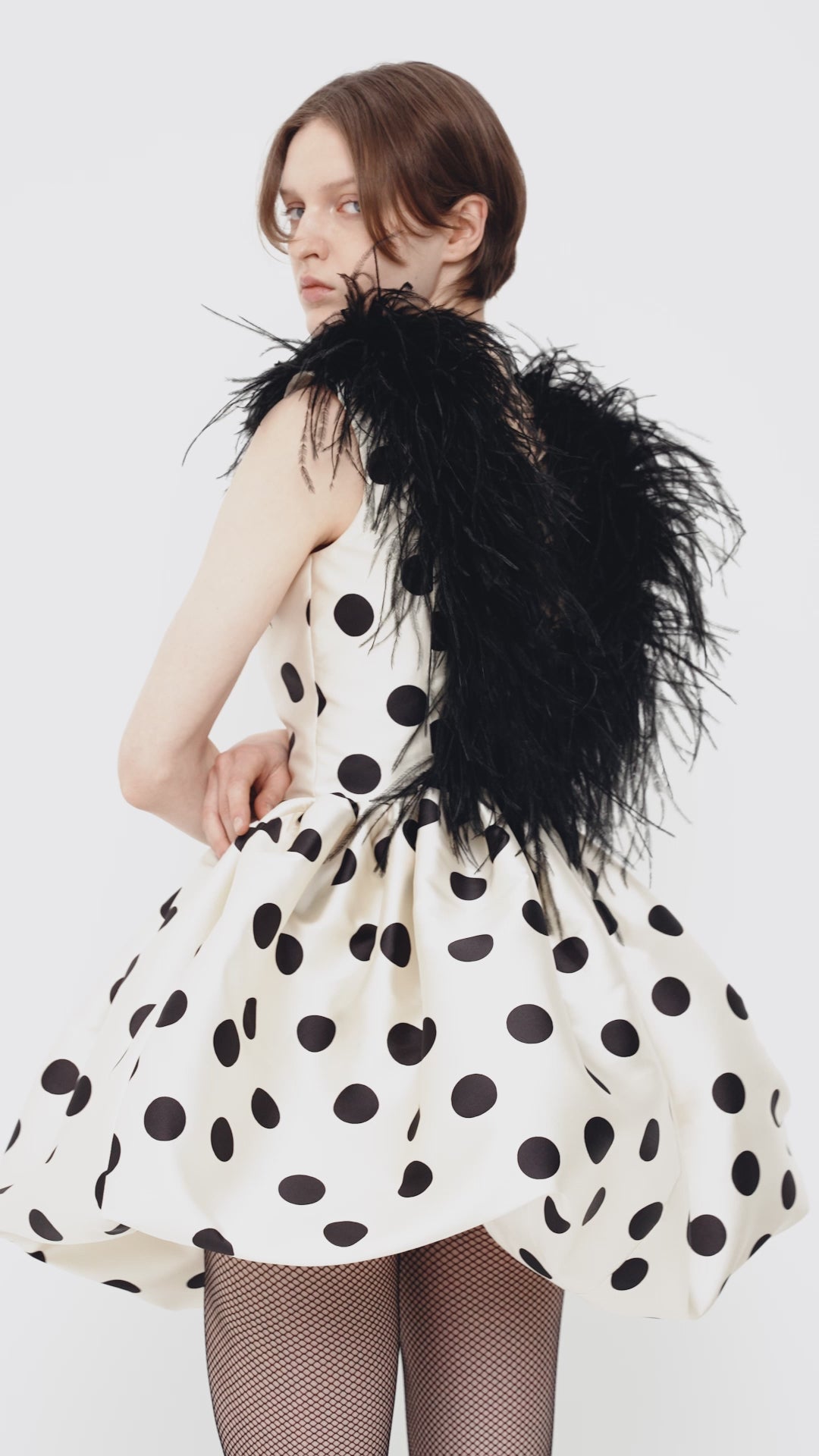 Polka-dot mini dress with ostrich feather trim