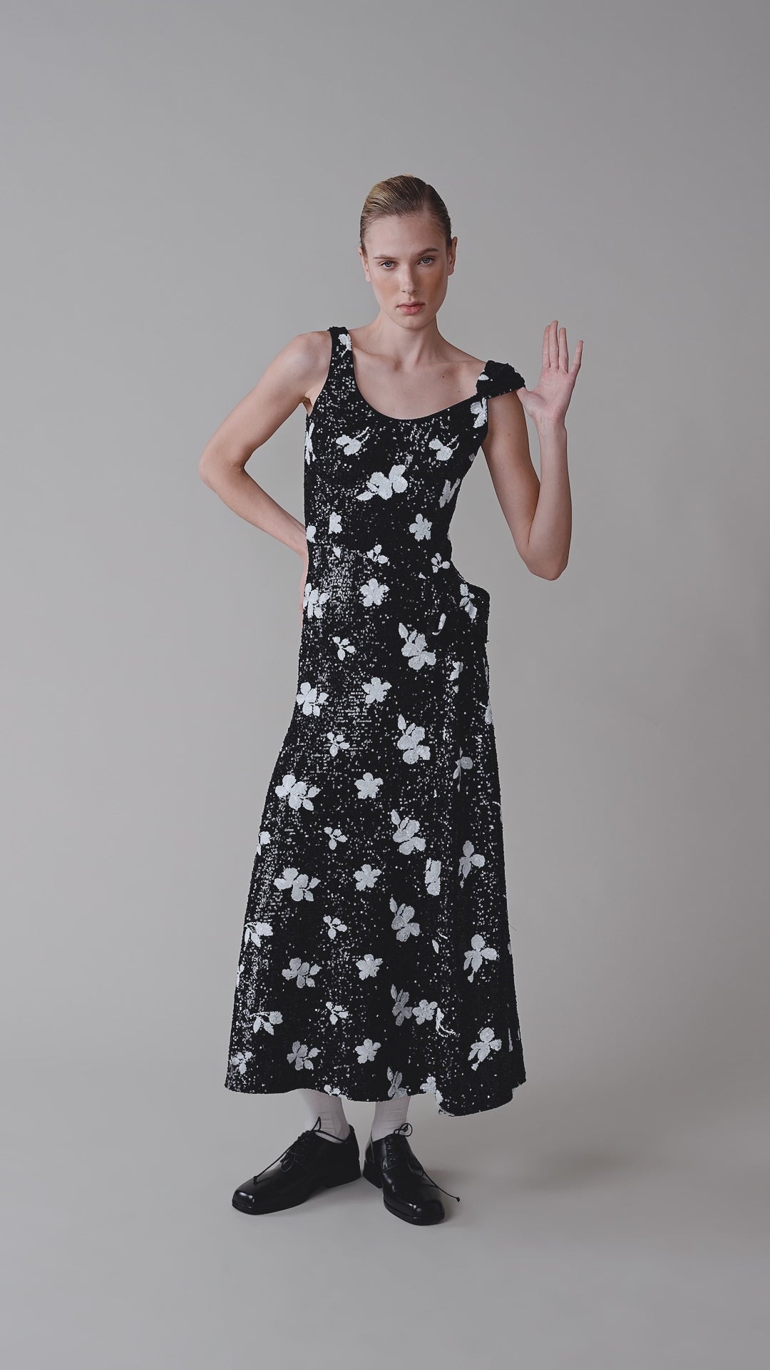 Sequinned dress with a waist bow