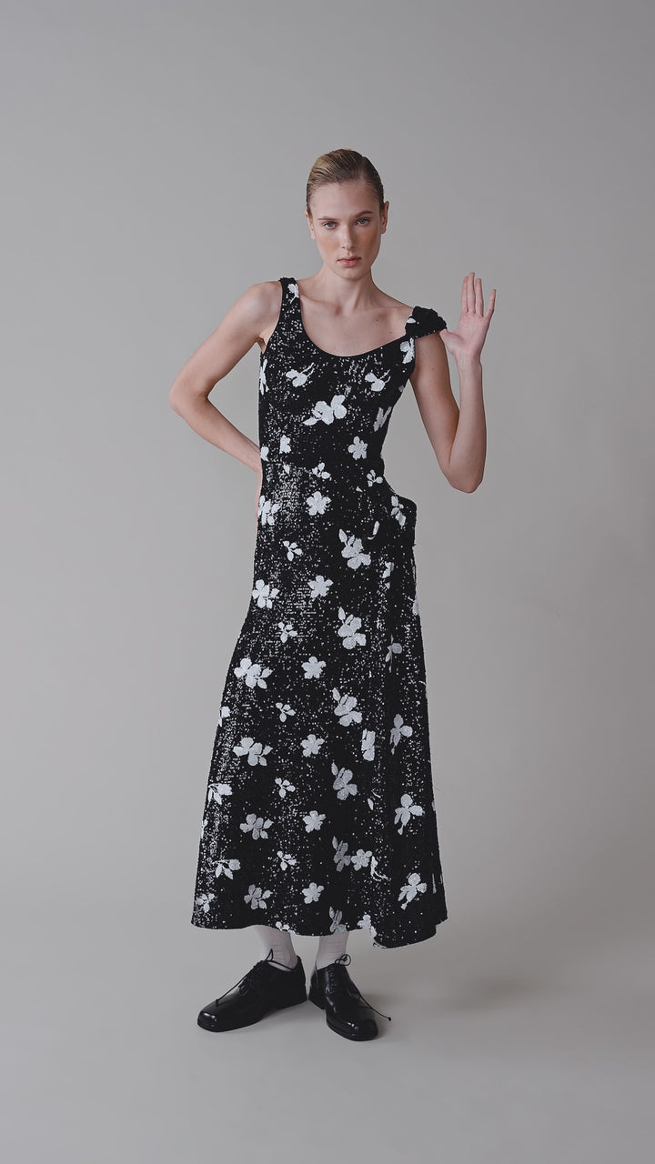 Sequinned dress with a waist bow