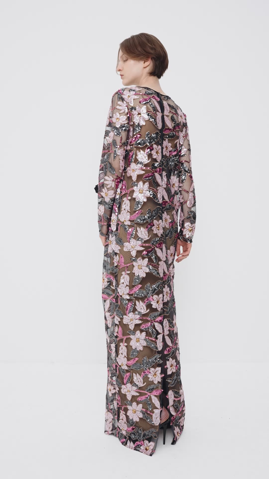 Sequin-embellished dress with a decorative flower