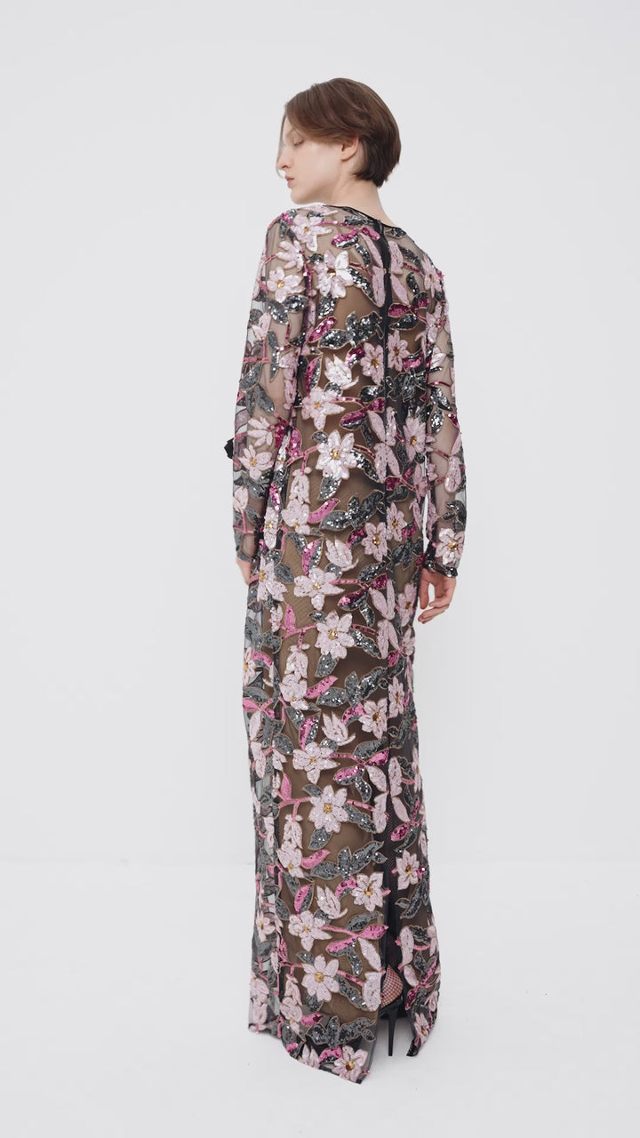 Sequin-embellished dress with a decorative flower