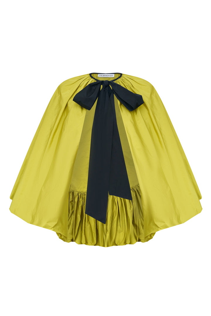 Cape with a contrast bow
